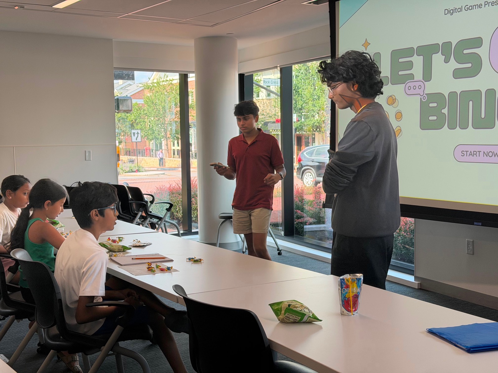 THHYE volunteers leading a digital game workshop for CMM kids
